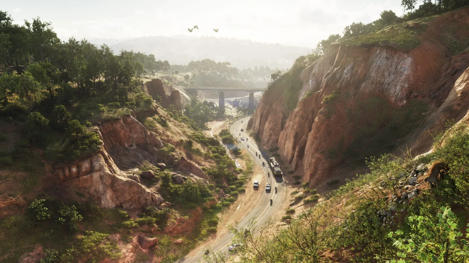 A red-rock canyon in GTA 6's Mount Kalaga with a highway and bridge winding through it